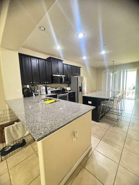 2515 Nouveau Way, Kissimmee FL - photo 8 of 36