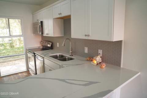 719 S Beach Street #103, Daytona Beach FL - photo 6 of 65
