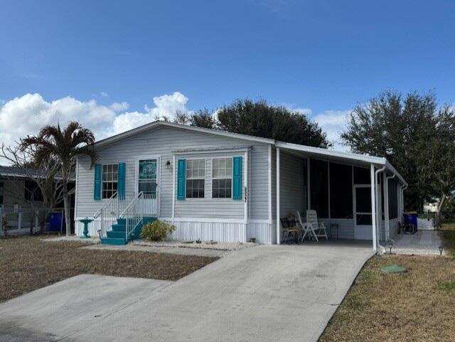 3 bedroom Manufactured Home at 6927 SE Delegate Street, Cambridge At Heritage Ridge, Hobe Sound — photo 1