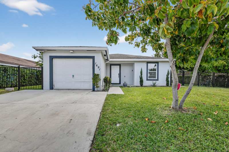4 bedroom Single Family Residence at 1691 W 26th Court, Davis, Riviera Beach — photo 1