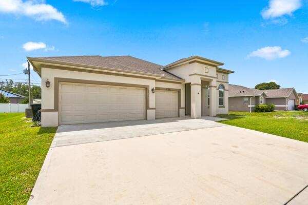 5 bedroom Single Family Residence at 1957 SW Logan Street, Port St Lucie Section 11, Port St. Lucie — photo 1