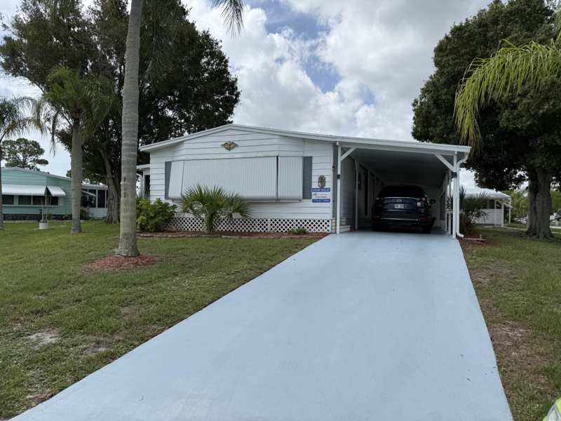 2 bedroom Manufactured Home at 2 Jose Martin, Spanish Lakes Country Club Village, Fort Pierce — photo 1