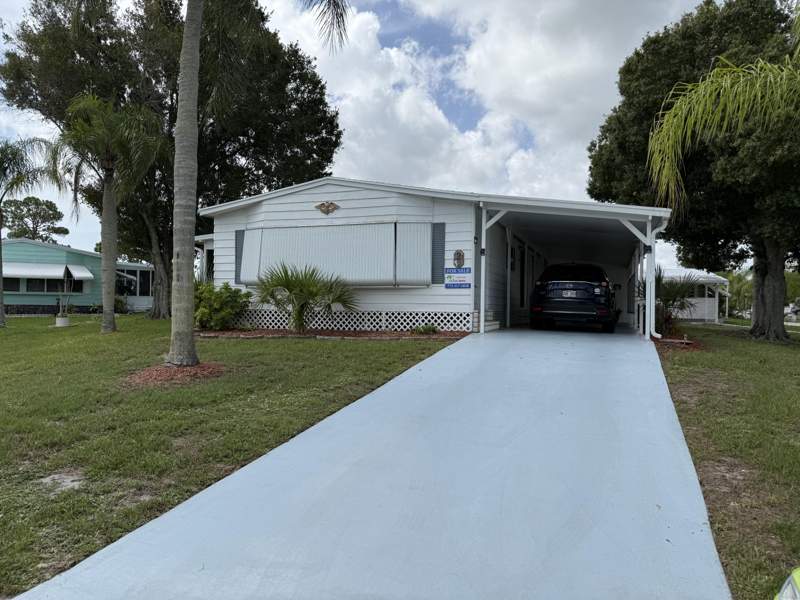 2 bedroom Manufactured Home at 2 Jose Martin, Spanish Lakes Country Club Village, Fort Pierce — photo 1