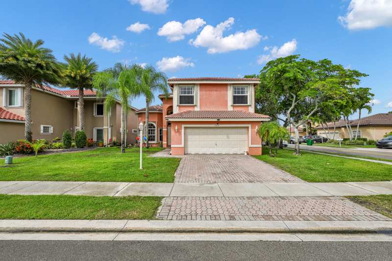 5 bedroom Single Family Residence at 11650 NW 48th Court, Wyndham Lakes East, Coral Springs — photo 1