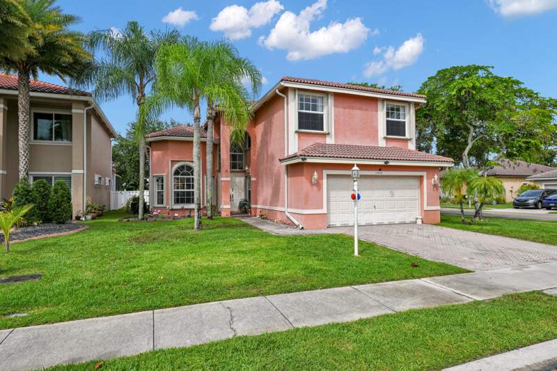 5 bedroom Single Family Residence at 11650 NW 48th Court, Wyndham Lakes East, Coral Springs — photo 2