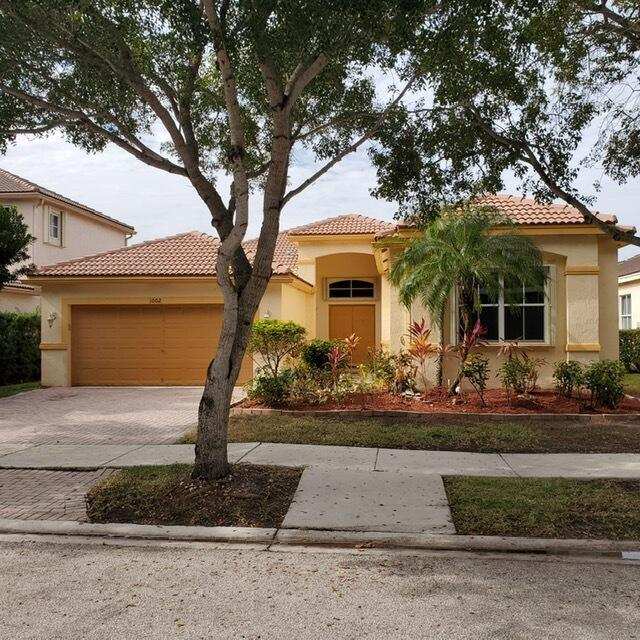 4 bedroom Single Family Residence at 1002 Lavender Circle, Sector 2-Parcels 17 18 19 & 20, Weston — photo 1