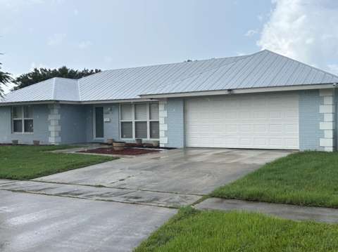 1473 SE Sunshine Avenue, home for sale in Port St. Lucie 34952