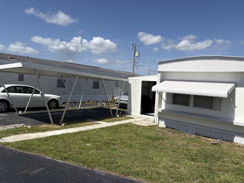2 bedroom Manufactured Home at 11055 SE Federal Highway #19, Woodbridge Mobile Village, Hobe Sound — photo 1
