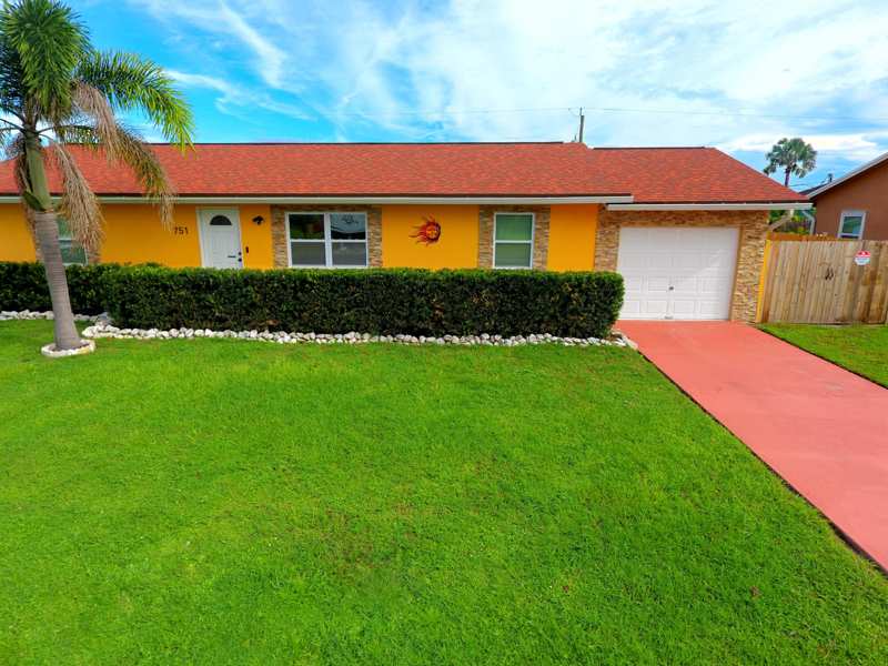 4 bedroom Single Family Residence at 751 NW Tremont Avenue, Port St Lucie Section 25, Port St. Lucie — photo 1