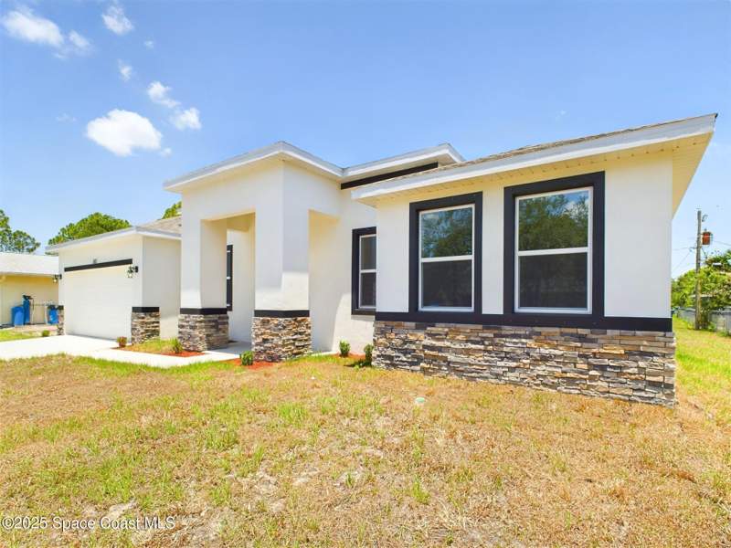 4 bedroom Single Family Residence at 692 Mistletoe Street, Port Malabar Unit 49, Palm Bay — photo 3