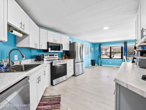 1040 Waterway Drive, Barefoot Bay FL - photo 10 of 32