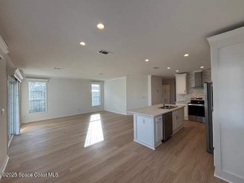 723 Hyacinth Circle, Barefoot Bay FL - photo 9 of 25
