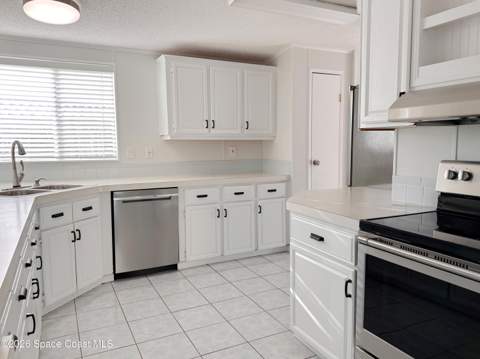 606 Dolphin Circle, Barefoot Bay FL - photo 8 of 19