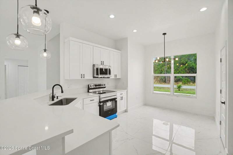4 bedroom Single Family Residence at 3267 Halacka Avenue, Port Malabar Unit 25, Palm Bay — photo 5