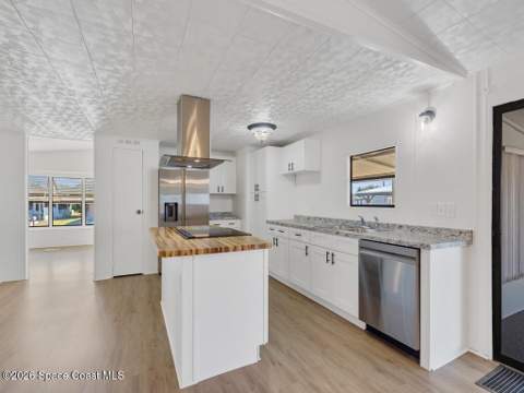 908 Oleander Circle, Barefoot Bay FL - photo 11 of 36