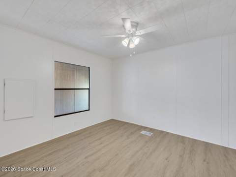 908 Oleander Circle, Barefoot Bay FL - photo 15 of 36