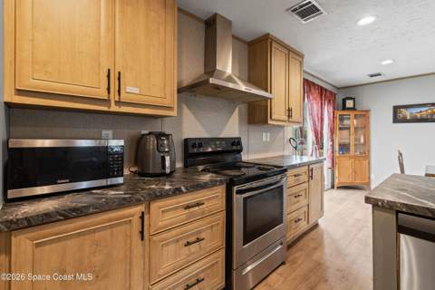 958 Pecan Circle, Barefoot Bay FL - photo 10 of 24