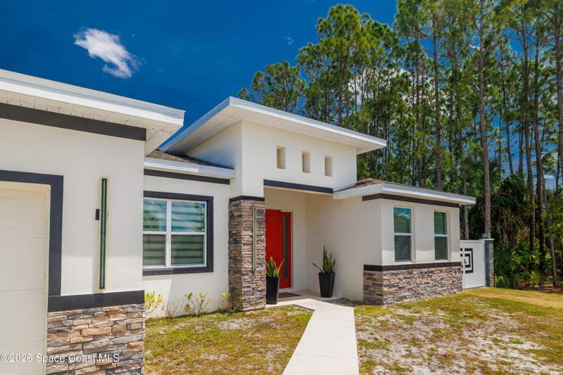 4 bedroom Single Family Residence at 457 Tillman Avenue, Port Malabar Unit 20, Palm Bay — photo 2