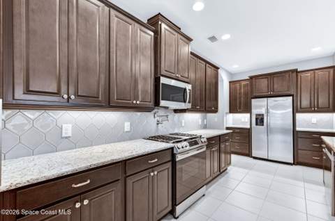 7945 Millbrook Avenue, Melbourne FL - photo 12 of 102