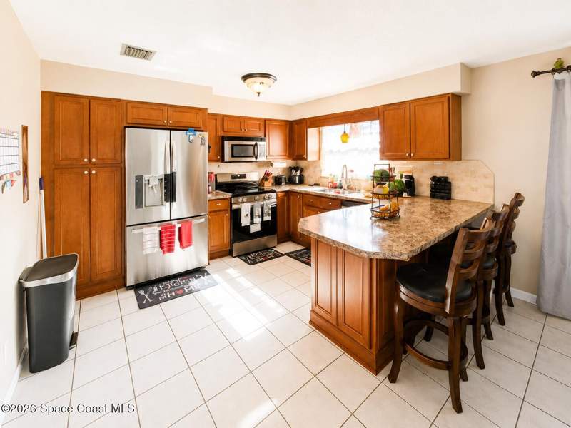 4 bedroom Single Family Residence at 4345 Elliot Avenue, Whispering Lakes 3rd Sec Part 1, Titusville — photo 5