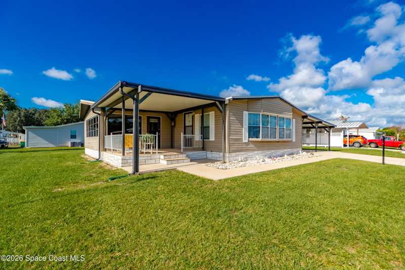 2 bedroom Manufactured Home at 409 Macadamia Drive, Barefoot Bay Unit 1, Micco — photo 1