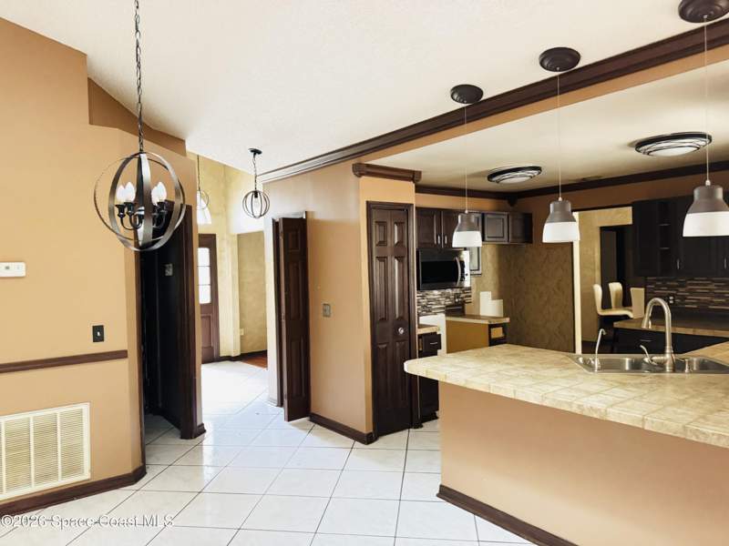 5 bedroom Single Family Residence at 3020 Forghun Avenue, Port Malabar Unit 25, Palm Bay — photo 2