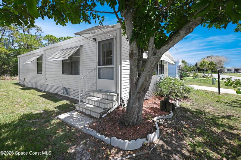 2 bedroom Manufactured Home at 451 E Egret Circle, Barefoot Bay Unit 2 Part 13, Barefoot Bay — photo 2