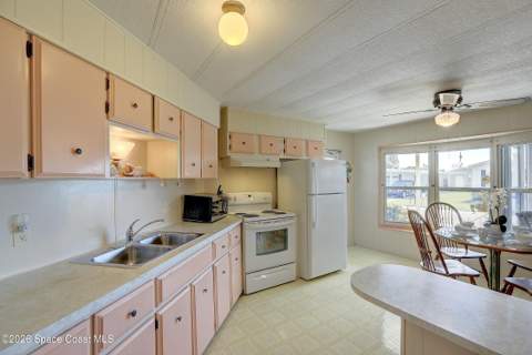 912 Oriole Circle, Barefoot Bay FL - photo 9 of 31