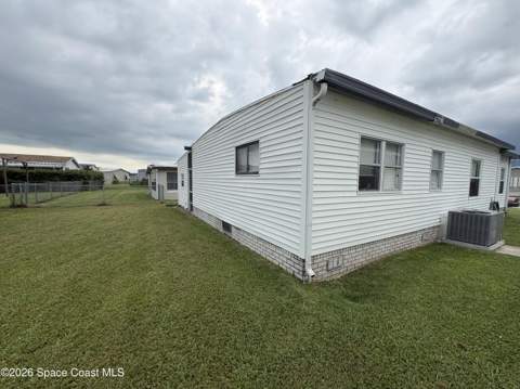 1153 Waterway Drive, Barefoot Bay FL - photo 9 of 59