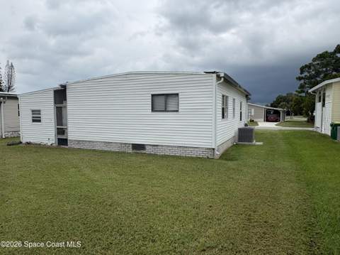 1153 Waterway Drive, Barefoot Bay FL - photo 10 of 59
