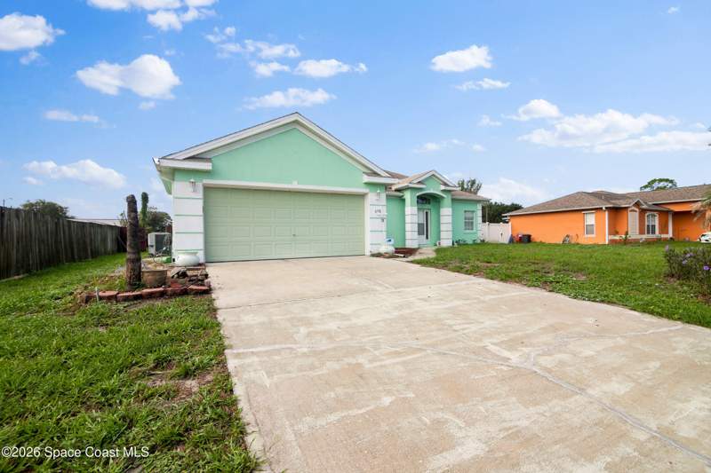 3 bedroom Single Family Residence at 698 Thuringer Street, Port Malabar Unit 48, Palm Bay — photo 1