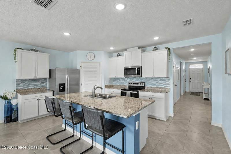 4 bedroom Single Family Residence at 1121 Mcfarland Drive, Dunes at Heritage Lakes, West Melbourne — photo 5