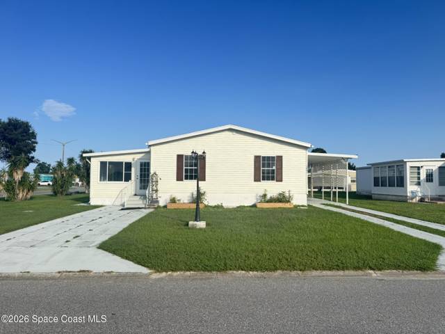 1001 Waterway Drive, home for sale in Barefoot Bay