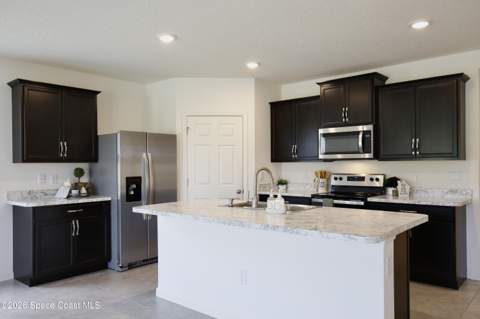 3020 Burrowing Owl Drive, Mims FL - photo 8 of 59