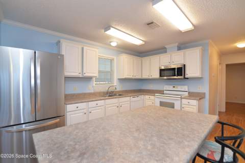 840 Hyacinth Circle, Barefoot Bay FL - photo 6 of 58