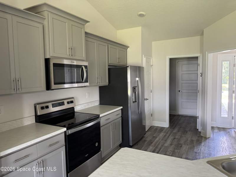 4 bedroom Single Family Residence at 883 Charcoal Avenue, Port Malabar Unit 11, Palm Bay — photo 2