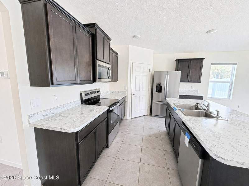 4 bedroom Single Family Residence at 597 J T Sancho Street, Port Malabar Unit 31, Palm Bay — photo 2