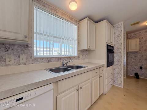 646 Periwinkle Circle, Barefoot Bay FL - photo 6 of 16