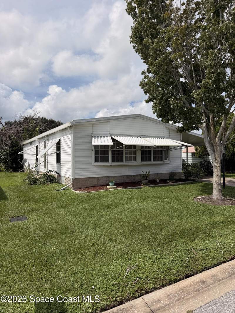 2 bedroom Single Family Residence at 633 Amaryllis Drive, Barefoot Bay Unit 2 Part 10 Replat of Park Areas, Barefoot Bay — photo 2