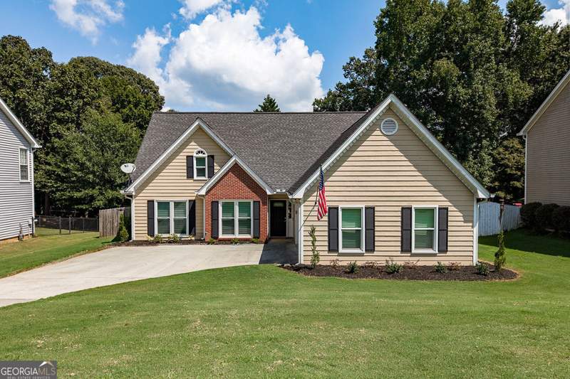 4 bedroom Single Family Residence at 5685 Sugar Crossing Drive, Sugar Crossing, Sugar Hill — photo 1